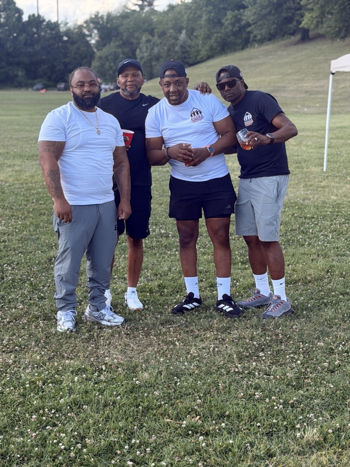 Community members standing together at the Father’s Day Cookout